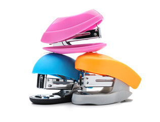 Colorful office staplers on white background