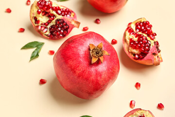 Fresh ripe pomegranates on color background, closeup