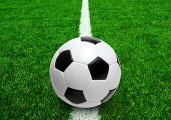 Fototapeta na wymiar Soccer ball on stadium field texture