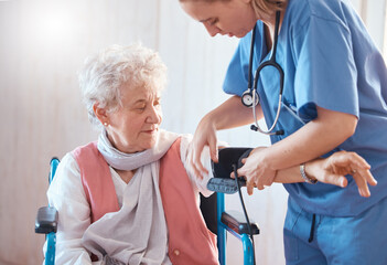 Disability, monitor and old woman with a nurse for blood pressure check in a medical healthcare...