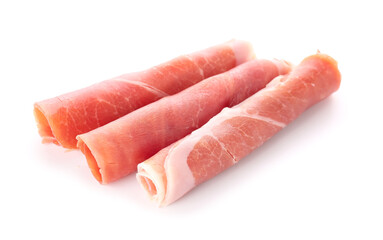 Rolled slices of tasty ham isolated on white background