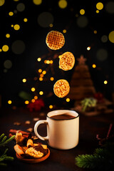 Winter drink on a dark background with Christmas decorations.
