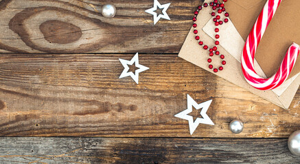 Wooden Christmas background with decor details, flat lay.