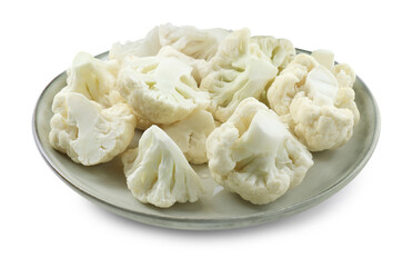 Plate with cut fresh raw cauliflowers on white background