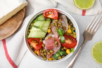 Bowl of salad with mung beans on white table, flat lay