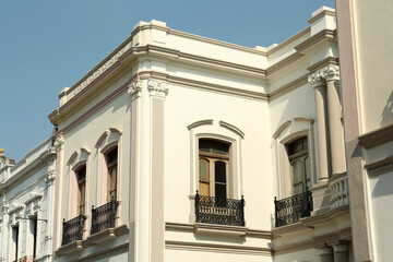 Fototapeta na wymiar Exterior of beautiful building with windows and balconies