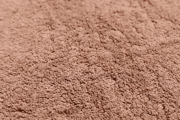 Dry soft brown towel as background, closeup