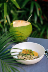 Plate with risotto at the table, outdoors