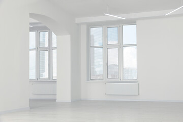 Fototapeta na wymiar Modern office room with white walls and windows. Interior design