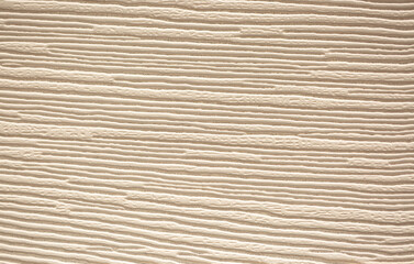 Brown background from decorative plaster with abstract spots. Unusual beige wall texture with beautiful patterns, creative surface background. Front covering for facing of buildings.