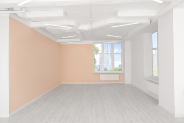 New empty office room with clean windows and beige walls