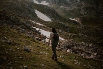 Naklejka na ściany i meble hiking in the mountains, woman hiking