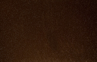 Brown background from decorative plaster with abstract spots. Unusual beige wall texture with beautiful patterns, creative surface background. Front covering for facing of buildings.