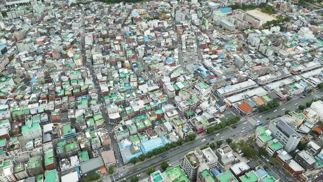 Looking down at the busy city with buildings complex and city park on the day, in Daegu city, Korea