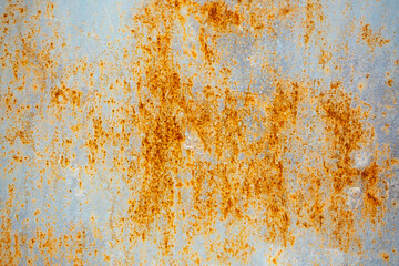 Texture of rusty iron, cracked paint on an old metal surface. Sheet of rusty metal with cracked and peeling paint, background for design with copy space.