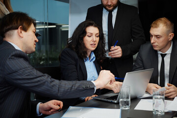 Business team having meeting discussing company progress