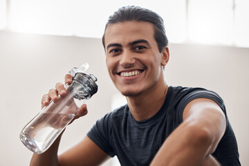 Fitness, happy portrait or man with water bottle in exercise, training or cardio workout in gym. Smile, freedom or athlete face for sport health energy, wellness motivation or drinking water to relax