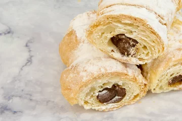 Stoff pro Meter Closeup of puff pastry chocolate cream horns with icing sugar. © Carlos Valle/Wirestock Creators