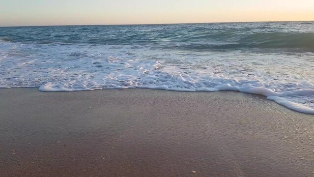 Beautiful blue turbulent Mediterranean sea and beach with fine sand	