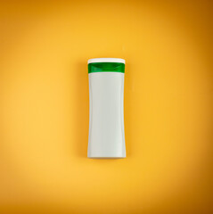 Shampoo Bottle on Yellow Background, Liquid Soap Plastic Container, Shower Gel Tube, Hair Conditioner Box