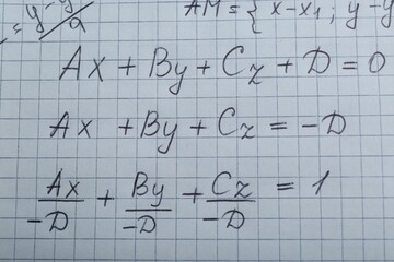 Sheet of paper with different mathematical formulas, top view