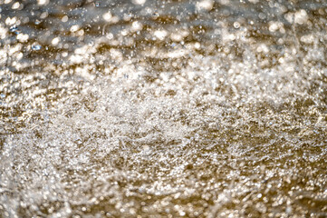 Obraz premium Water splash with small drops in the fountain. Abstract natural, selective focus, copy space