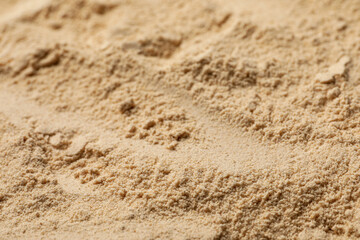 Fototapeta na wymiar Heap of buckwheat flour as background, closeup