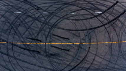 Top view tire tracks texture and background. Asphalt texture with line and tire marks. Automobile...