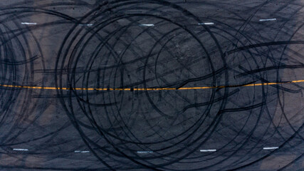 Top view tire tracks texture and background. Asphalt texture with line and tire marks. Automobile...