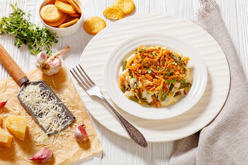 cheesy green bean casserole on plate, top view