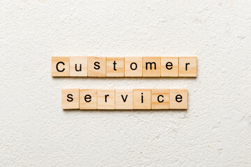 customer service word written on wood block. customer service text on cement table for your desing, concept