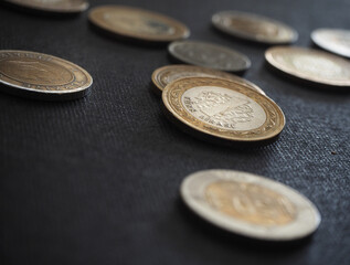 Turkish coins on black background. Focused on 1 TL.  