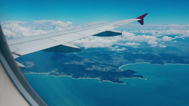 Airplane flies over Brazil. Window view of the Brazilian coastline as seen from the aircraft window