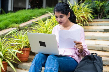 young student at college campus buys working on project using laptop - concept of learning or exam preparation, knowledge and hard-working