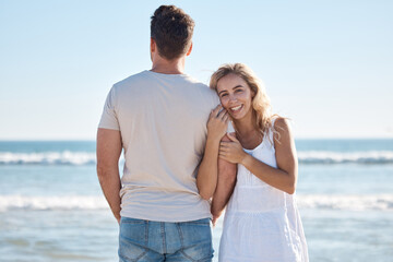 Couple, hug and love for travel, beach or summer vacation relaxing or bonding together in the outdoors. Woman holding man in loving embrace with smile for happy relationship or traveling by the ocean