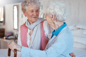 Happy, friends and senior women talking and bonding in a bedroom together of a retirement home. Happiness, conversation and retired elderly female best friends with a smile speaking of gossip in room
