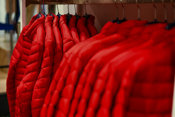 unisex down jackets on a hanger sale in the store