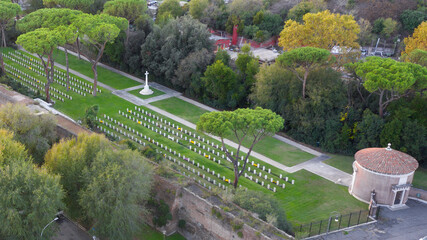 Aerial view of Commonwealth cemetery in Rome. The tombs of the fallen are simple rectangular tombstones arranged on parallel rows. It' s located in Testaccio district.