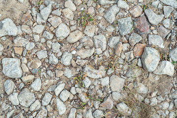 Background with stones scattered on the ground and small natural debris. Natural countryside background.