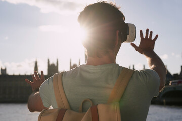 Virtual reality glasses, man back and outdoor metaverse adventure, 3d futuristic software and gaming innovation. Ai technology, vr fantasy video and online cyber streaming or digital headset in city