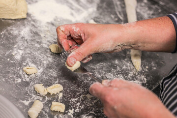 hands preparing gnocchi