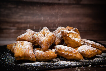 TRADITIONAL WONDERS OF SOUTH-WESTERN FRANCE, SPRINKLED WITH ICING SUGAR AND FLAVOURED WITH RUM AND ORANGE FLOWER WATER, High quality photo