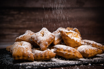 TRADITIONAL WONDERS OF SOUTH-WESTERN FRANCE, SPRINKLED WITH ICING SUGAR AND FLAVOURED WITH RUM AND ORANGE FLOWER WATER, High quality photo