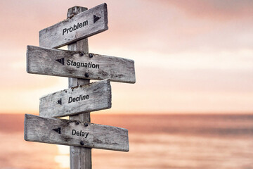 problem stagnation decline delay text written on wooden signpost outdoors at the beach during sunset