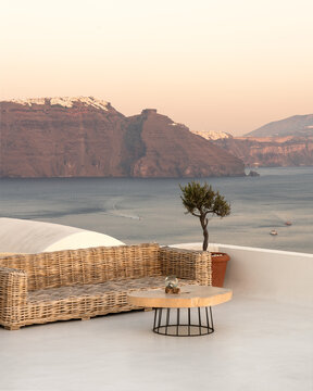 Dreamy minimalist terrace and bench in Santorini island in Greece overlooking the Aegean sea