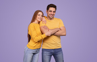 Young couple in similar clothes
