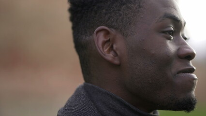 Naklejka premium Positive emotion, black african man smiling close-up face