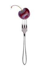 Fresh red cherry berry fruit on fork isolated on white background.