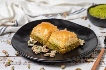 Pistachio baklava on a white wooden background. Turkish cuisine delicacies. Turkish baklava. close up