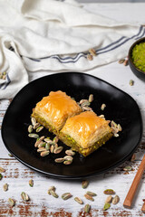 Pistachio baklava on a white wooden background. Turkish cuisine delicacies. Turkish baklava. close up